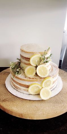 a cake with lemons and rosemary on top