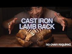 a woman with her hands out in front of some meat on a table and the words cast iron lamb rack