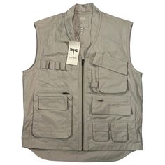 Tyler Bo Tan Zip Up Sleeveless Fishing Safari Cargo Outdoor Multipurpose Vest Unisex Size Medium Mens I Would Say Fits Like A Large For Women, Lots Of Pockets, Loops And Adjustable Back, Slight Collar, Khaki Tan Color, Zipper Down The Front,Great For Lots Of Activities, Camping, Fishing, Hunting, Outdoor Hiking, Rock Climbing, Safari, Outback, Movies, Photography Pit To Pit (Chest) 23” Across Front Length In The Front From Top Of Shoulder 24 1/2” Length In The Back From Top Of Shoulder 28 1/2” A Affordable Utility Vest For Outdoor Activities, Cream Utility Vest, Safari Vest, Fishing Vest, Rock Climbing, Outdoor Hiking, Tan Color, Military Jacket, Climbing