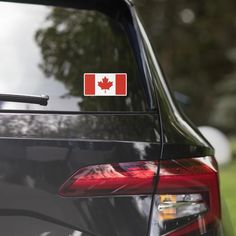 a canadian flag sticker on the back of a car