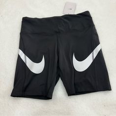 Nike Fast Shorts Black With White Swoosh Tight Fit Has A Zippered Back Pocket See Photos For Approximate Measurements Ynf 13507 Black Letter Print Workout Bottoms, Black Short Activewear With Letter Print, Trendy Fitted Black Athletic Shorts, Nike Black Fitted Athletic Shorts, Fitted Nike Black Athletic Shorts, Black Biker Shorts With Letter Print, Nike Black Bottoms With Letter Print, Nike Fitted Black Biker Shorts, Nike Sporty Bottoms With Letter Print