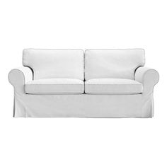 a white couch sitting on top of a white floor