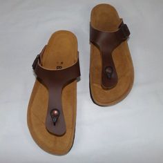 Size 11 Bayton Mercure Thong Sandal Camel. These Casual Minimalist Sandals Have A Genuine Leather Brown Upper With An Adjustable Strap That Covers The Top Of The Foot. The Insoles Include A Small Arch Support For Comfort. Condition Is New Without Tags Or Box. These Shoes Are Perfect For Traveling, The Outdoors, Or The Beach! Brown T-strap Sandals For Beach With Textured Footbed, Brown T-strap Sandals With Textured Footbed For Beach, Brown T-strap Sandals With Cushioned Footbed, Casual Brown Flip Flops With Single Toe Strap, Brown Flip Flops With Textured Footbed, Casual Brown T-strap Sandals With Textured Footbed, Brown T-strap Sandals With Cushioned Footbed And Adjustable Fit, Brown Adjustable T-strap Sandals With Cushioned Footbed, Adjustable Brown T-strap Sandals With Cushioned Footbed