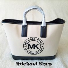 100% Cotton Canvas Material. Dual Top Handle With Removable And Adjustable Shoulder Strap. Snap Closure. Lined. One Interior Zip Pocket And Two Interior Slip Pockets. Gold Hardware. Never Used. Dimensions: 17.5"W X 11.5"H X 7"D. Large White Luxury Bag, Chic Michael Kors Bag With Logo, Large White Bag With Top Carry Handle, Beige Logo Shoulder Bag For Errands, Designer White Canvas Bag For Daily Use, White Luxury Canvas Shopping Bag, Luxury White Canvas Shopping Bag, Luxury White Rectangular Canvas Bag, Elegant Large White Bag