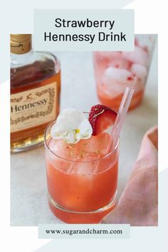 strawberry hennessy drink in a glass with ice and strawberries