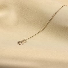 Introducing our White Gold Box Chain - an elegant and understated addition to any outfit. Made with 14k solid gold, this dainty and delicate chain is perfect for those who appreciate subtle luxury. Enchant and elevate your style with this versatile piece. Gold KT: 14K Solid Gold Gold Color: White Gold Chain Lengths: 14", 16", 18", 20" Chain Widths: 0.5mm, 0.7mm, 0.8mm Chain Style: Box Clasp Closure: Spring Ring Subtle Luxury, Box Chain Necklace, Style Box, White Gold Chains, Gold Box, Box Clasp, White Gold Necklaces, Delicate Chain, Necklace Dainty