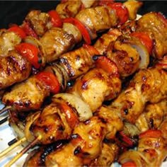 the skewers are covered with meat and vegetables