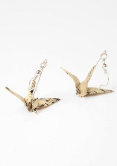 pair of origami bird earrings on white background