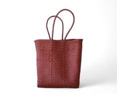 This Wine Burgundy Mexican artisan tote is a one-of-a-kind, handmade shoulder bag that combines rich color with traditional craftsmanship. Exclusive Artisan Craftsmanship: Handwoven by skilled artisans—only one piece available. Rich Wine Burgundy Color: Adds a touch of sophistication to any ensemble. Open-Top for Easy Access: Reach your essentials quickly without closures. Comfortable Long Handles: Designed for effortless over-the-shoulder wear. Versatile Design: Perfect for shopping, work, beach outings, or everyday adventures. Durable & Easy to Clean: Retains its shape, lightweight, and simple to maintain. Dimensions: 14 x 7 x 15 inchesColor: Wine Burgundy Mexican Bags, Mexican Bag, Basket Tote, Medium Handbags, Everyday Adventures, Medium Tote, Small Handbags, Burgundy Color, Open Top