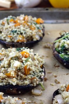 baked stuffed mushrooms with vegetables on a baking sheet