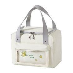 a white lunch bag with lemons on it