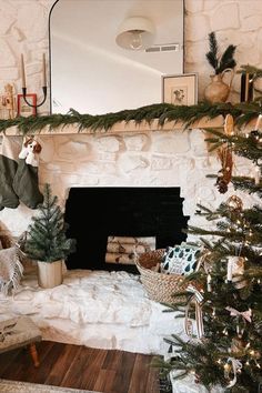 a living room with a christmas tree and fireplace