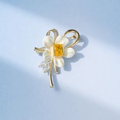 Elevate your outfit with this stunning Copper Yellow Diamond Flower Brooch. Adorned with intricately cut yellow diamonds, this brooch adds a touch of elegance to any ensemble. The perfect accessory for a special occasion or to elevate your everyday look.      Tarnish proof    Water proof    Sleep / Nap proof    Safe for sensitive skin    Wear it while working out &showering    Designed to wear 24/7    If there is no stock, the product will take   60    days to produce    Please leave your usual Diamond Flower Brooch, Yellow Diamonds, Moss Agate Ring, Flat Back Earrings, Feather Necklaces, Gold Bracelet Chain, Diamond Flower, Blue Zircon, Rose Gold Jewelry