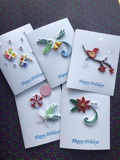 four greeting cards with different designs on them, one is for happy holidays and the other is for christmas