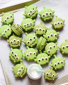 there are many green cookies with eyes on them