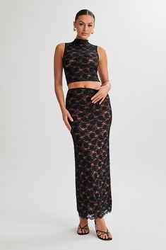 Not your grandma’s lace.Unleash your inner elegance with the ELSKA Lace Maxi Skirt—an embodiment of grace and sophistication. Designed with a mid-rise waist, this skirt accentuates your curves with a bodycon fit that radiates modern allure. The intricate lace detailing, complemented by a lining, adds a touch of refinement, creating a harmonious blend of style and comfort. The maxi length ensures a dramatic and graceful silhouette, making it a perfect choice for any occasion. Elevate your wardrob High Neck Lace Top, Lace Maxi Skirt, Maxi Lace Skirt, Lace Corset Top, Cocktail Dress Prom, High Neck Top, Beige Dresses, Lace Corset, Basic Dress