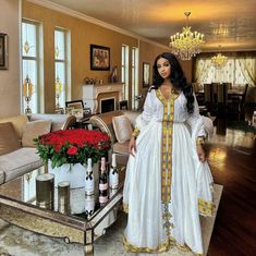 This modern yet culturally influenced Ethiopian dress shouts nothing but elegance. Its simple and vibrant color shows the detail-oriented, time consuming and as a whole beautiful process of dress production. wear this flawless dress for any events. Material Cotton Menen Thread Estimated delivery : 2 weeks to 3 weeks Contact WhatsApp +1(304)-306-2784Email: contact@ethiopian.store Holiday Wedding Dress, Cultural Dress, Habesha Dress, Ethiopian Traditional Dress, Ethiopian Dress, Habesha Kemis, Golden Design, Holiday Wedding, Traditional Dress