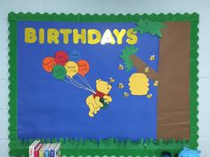 a bulletin board with winnie the pooh and balloons