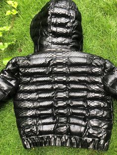 WINTER COLLECTION 2020/2021 Snakeskin DUCK DOWN Jacket for women. A jacket made from genuine python leather. Removable hood. Outside: GENUINE PYTHON LEATHER Inside: DUCK DOWN 100% Accessories: silver color (please see the photo). Lining: MONCLER All our products are 100% handmade, we always try to create interesting ideas to make your style unique. We use only the highest quality materials and accessories from around the world and only best leather from Indonesia. Before listing each new model u Luxury Crocodile Pattern Leather Jacket For Winter, Luxury Quilted Black Leather Jacket, Luxury Winter Outerwear With Crocodile Pattern, Luxury Crocodile Pattern Winter Outerwear, Fitted Crocodile Pattern Outerwear For Winter, Luxury Black Hooded Puffer Jacket, Luxury Hooded Jacket With Padded Collar, Luxury Black Hooded Leather Jacket, Black Leather Puffer Jacket