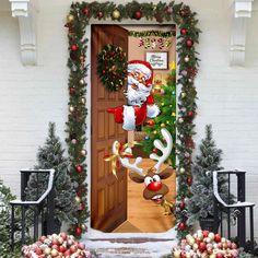 an open door decorated with christmas decorations and santa clause coming out from it, surrounded by wreaths