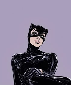 a black catwoman sitting on top of a chair