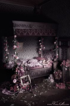 a bed with pink flowers on it in a room that is very dark and creepy