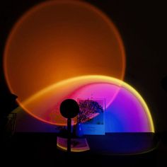 an image of a colorful object in the dark with light coming from it's back