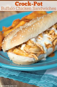 crock pot buffalo chicken sandwiches on a blue plate with french fries in the background