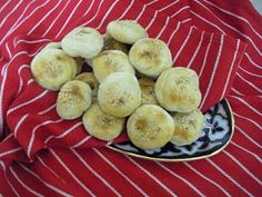 a plate filled with bananas on top of a red and white table cloth