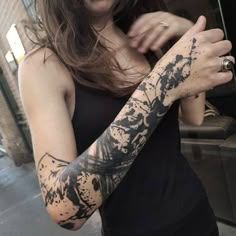 a woman with a tattoo on her arm