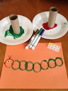 two paper plates and some crayons on a table