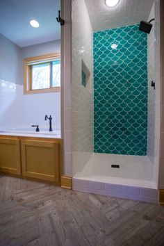 a bath room with a sink and a shower