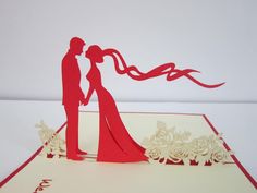 a wedding card with the silhouette of a bride and groom