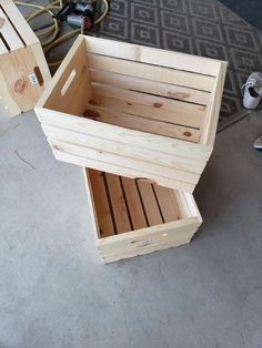 two wooden crates sitting on top of a cement floor