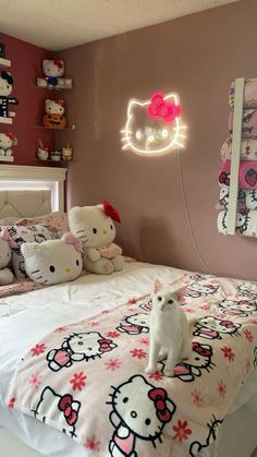 a bedroom with hello kitty bedding and pink walls