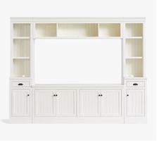 a white entertainment center with two doors and three cupboards on the bottom, one door open