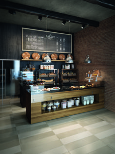 a bakery with lots of baked goods on display in front of the counter and menu