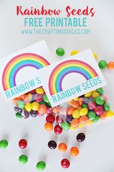 two rainbow seed packets sitting on top of each other next to jelly beans and candies