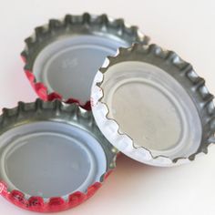 three empty bottle caps sitting next to each other