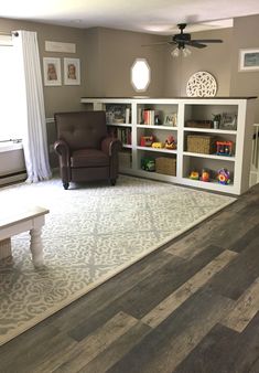 the living room is clean and ready to be used for children's playrooms