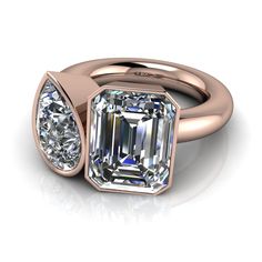 Toi Et Moi ring shown with a 9x7mm, 2.55 ct. emerald cut colorless moissanite, DEF Color, VVS clarity.9x6mm, 1.50 ct. pear colorless moissanite, DEF Color, VVS Clarity. **Band width 2.5mm, band thickness 2.5mm. *4.05 carat total weight. *Your moissanite stone arrives with a warranty card/certification of authenticity.*The ring is custom made just for you in your ring size and metal preference. *Please contact us prior to purchasing with any questions, we are happy to help. Wax Jewelry, Mens Gemstone Rings, Rings Mens Wedding Bands, Bezel Set Ring, Moissanite Necklace, Forever One Moissanite, Dream Engagement Rings, Lost Wax, Moissanite Rings