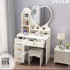 a white vanity with drawers and a mirror