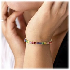 Rainbow Cubic Zirconia Tennis Bracelet in Gold with Rainbow Marquise Stones Introducing the Rainbow Tennis Bracelet - the perfect way to add some excitement to your tennis game! This stylish bracelet is made of white or yellow gold and adorned with beautiful rainbow marquise cubic zirconia stones. The perfect accessory for a tennis pro, or anyone who loves to hit the courts. 18k Gold Plated Length 7 Inches Width .25 Inches Color Gold or Silver Gemstone 1: Cubic Zirconia in; Saphire, Emerald, Cit Bracelet In Silver, Cubic Zirconia Necklace, Claw Setting, Stylish Bracelet, Orange Sapphire, Cubic Zirconia Earrings, Zirconia Earrings, Stone Gold, Stunning Earrings