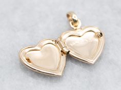 Crafted with precision, this mini etched heart shaped locket is a must-have for any jewelry collection. Made with delicate details, it adds a touch of elegance to any outfit. Keep your loved ones close to your heart with this timeless piece.This pendant does not come with the chain shown. Don't hesitate to get in touch with us, we will help you find the perfect chain for your style and budget! Metal: 14K Yellow GoldShape: Heart Heart Shaped Locket, The Chain, Heart Locket, Delicate Details, Loved Ones, Etching, Locket, Heart Shapes, Jewelry Collection