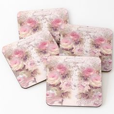 four coasters with pink roses on them