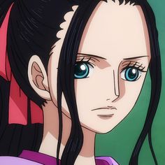 a woman with long black hair and blue eyes