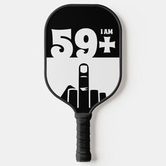 a black and white paddle with the number nine on it's side, which reads i am 69