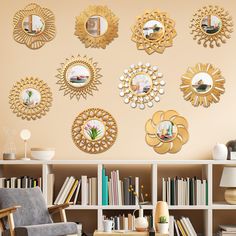 a living room filled with furniture and lots of gold mirrors on the wall above it