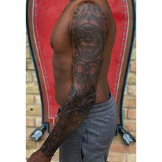 a man with a tattoo on his arm