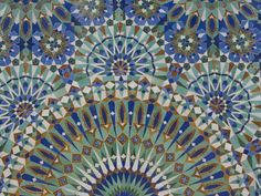 an intricately designed tile with blue and green colors